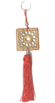 Pendentifs / porte-cles en bois de forme carree sculpte d'arabesques et pompon en sabra de couleur rouge